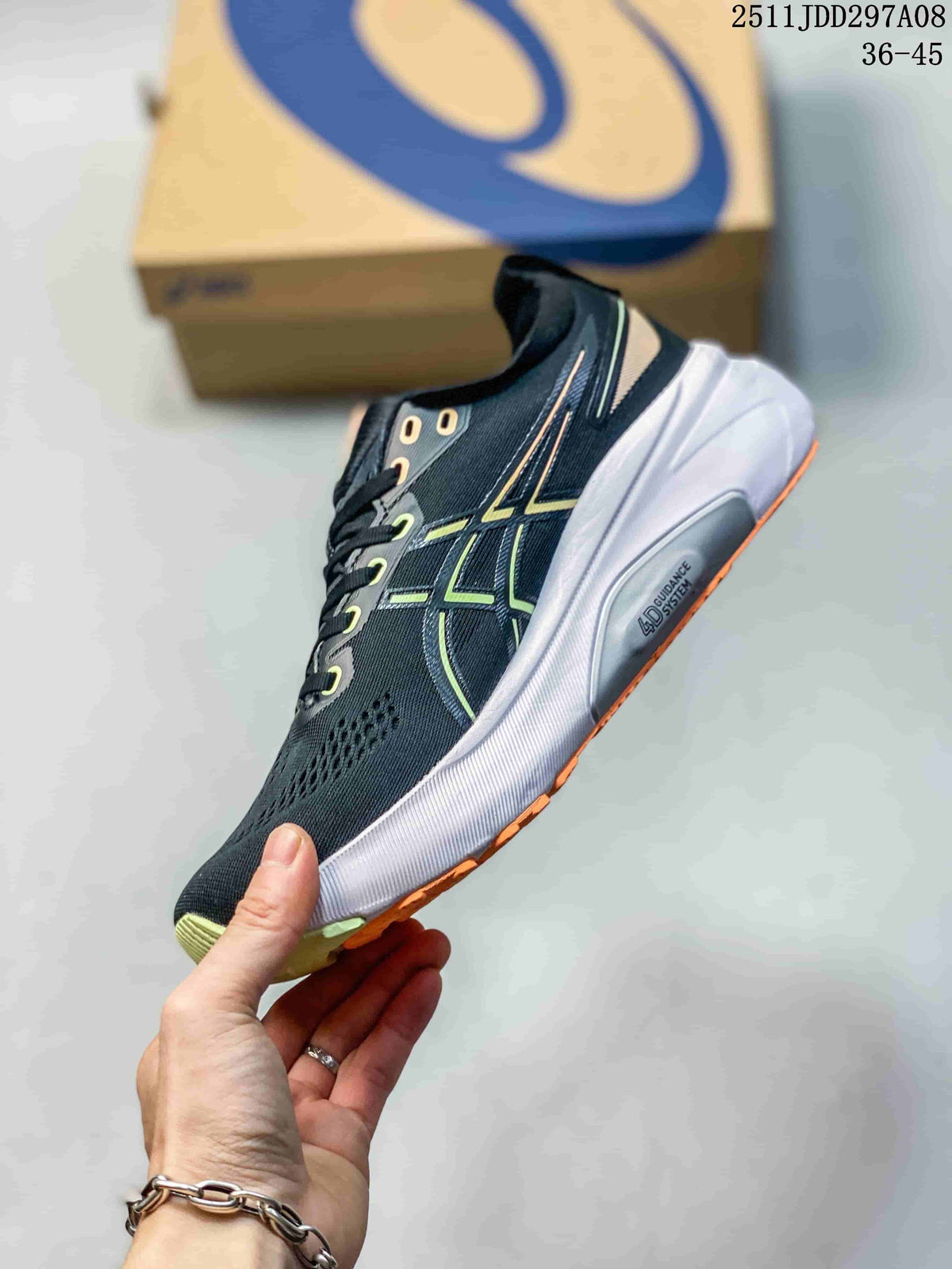 Side view of the black running shoe showing green ASICS side stripes, orange outsole detail and a white midsole marked Guidance System.