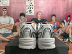 Rear view of silver-tone New Balance 530 sneakers with light-colored layered soles.