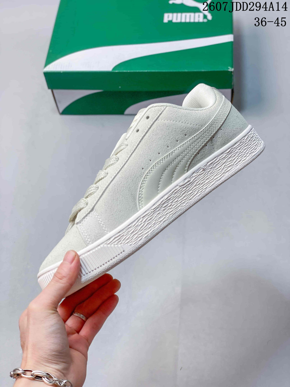Side profile of the white low-top sneaker showing the side formstrip, lace eyelets and textured sole.