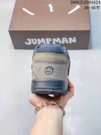 Rear view of a mocha and dark blue-gray Jordan Jumpman Jack sneaker