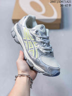 Angled side view highlighting the silver, white, and lime upper and textured outsole.
