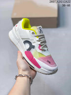 Angled side view highlighting the white upper, pink side accent, neon yellow forefoot detail and On branding.