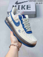 Close-up of a blue-and-white low-top sneaker showing its side, laces, and contrasting sole.