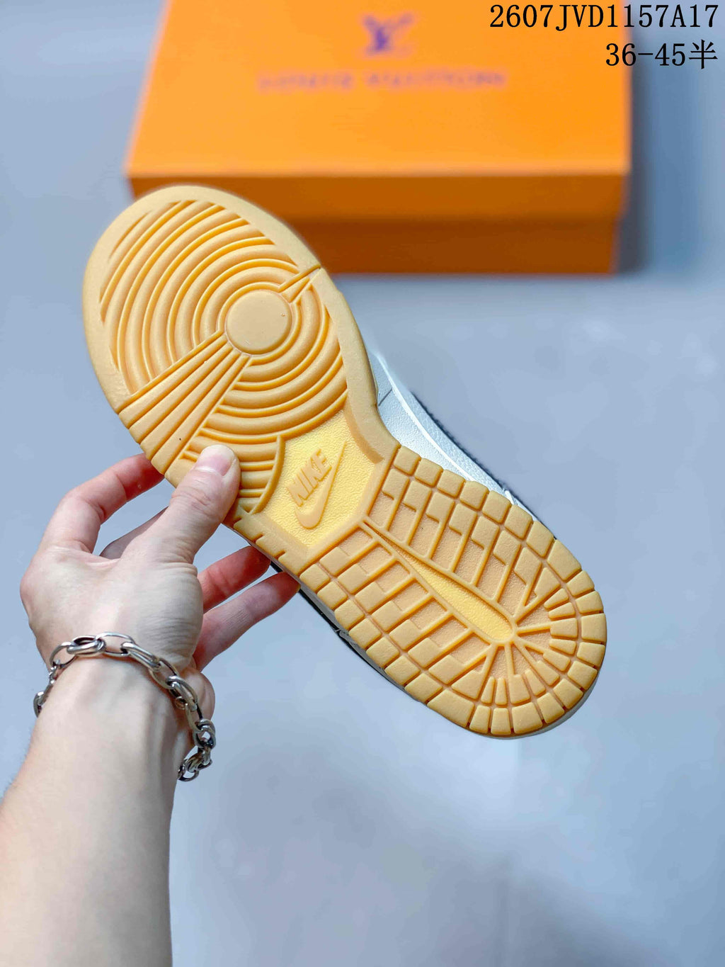 Close-up of the gum-colored outsole showing circular traction under the forefoot and patterned tread across the sole.