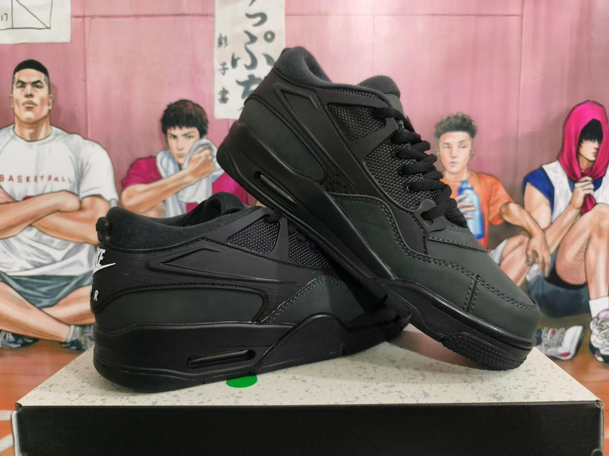 Pair of black Nike sneakers displayed at an angle, showing the side panels and heel branding.