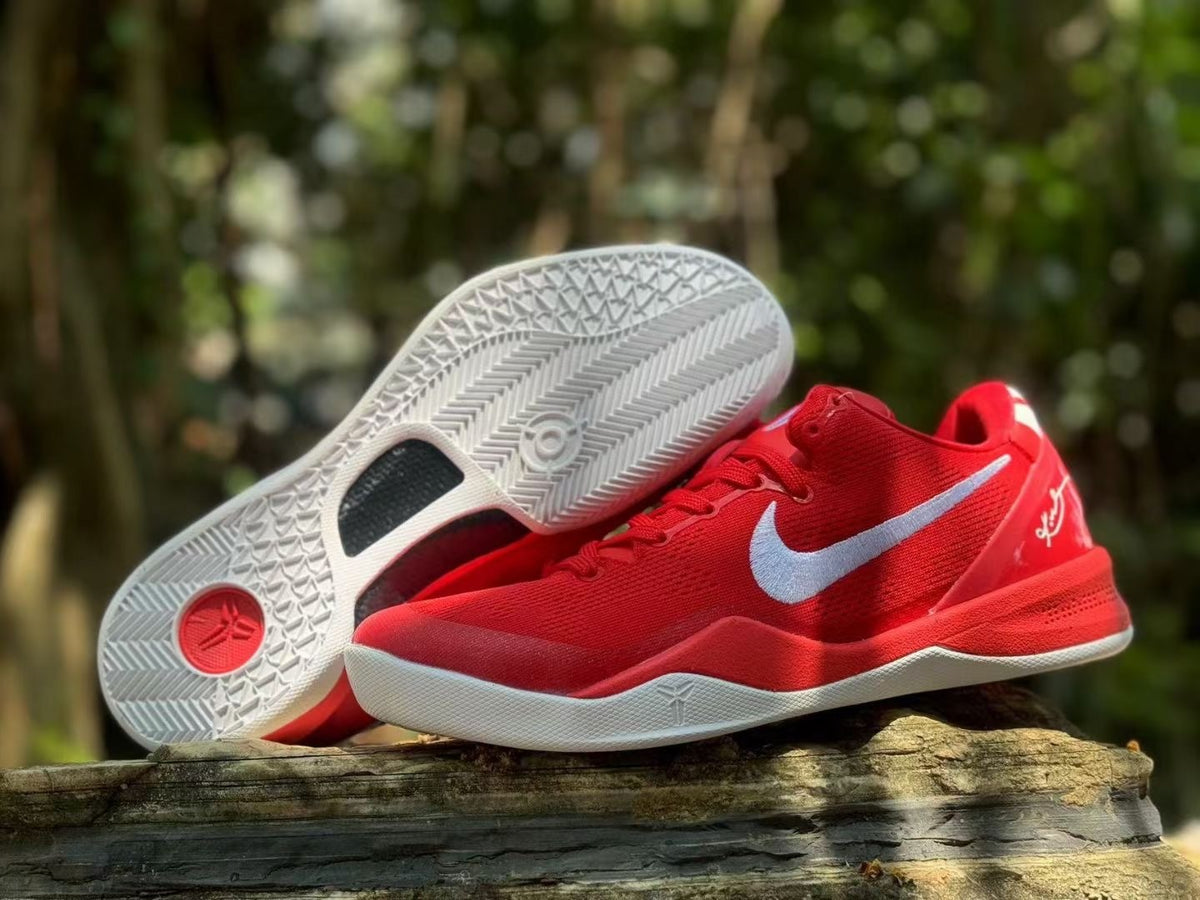 Red Nike Kobe 8 shoes displayed with the patterned white outsole visible