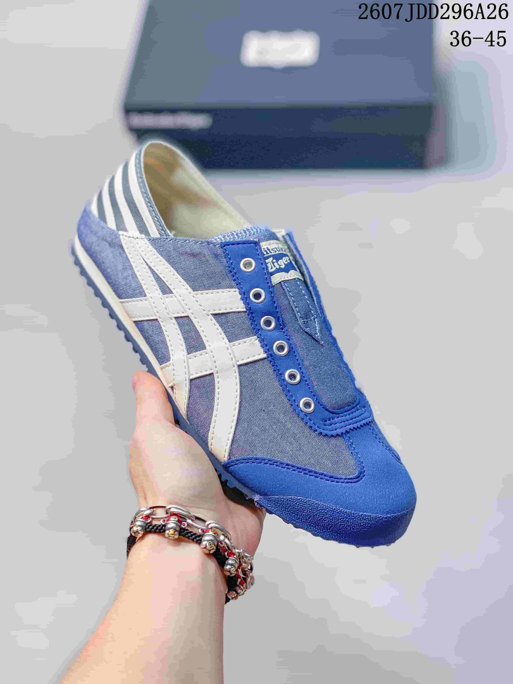 Blue Onitsuka Tiger Mexico 66 slip-on sneaker with white side stripes and a blue textured outsole.