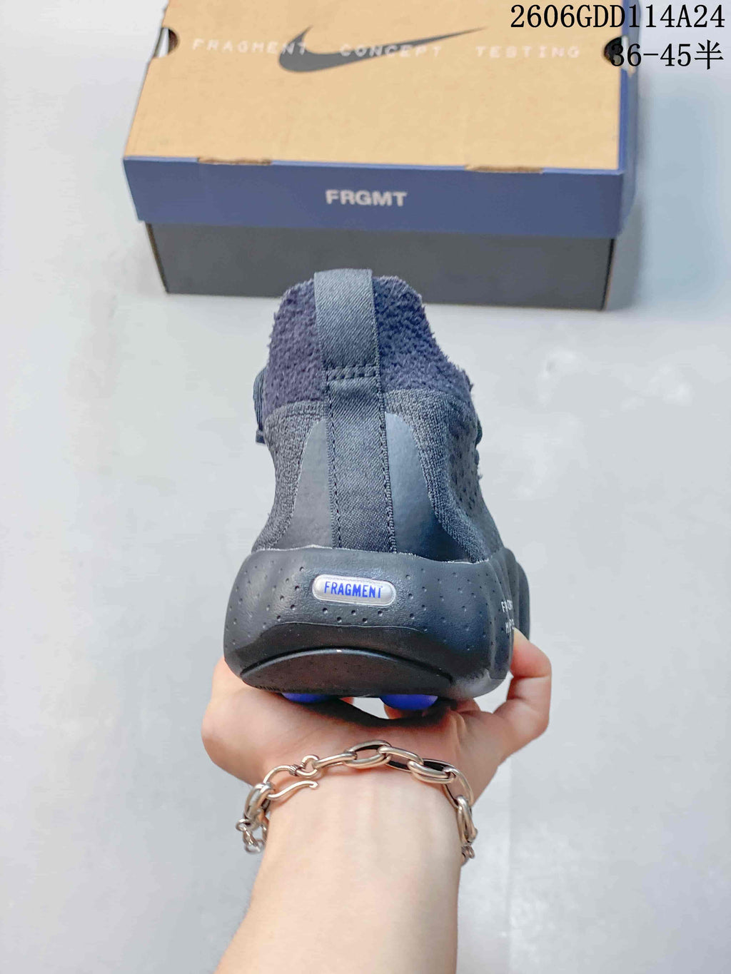 Rear view of the shoe with a pull tab and perforated heel section
