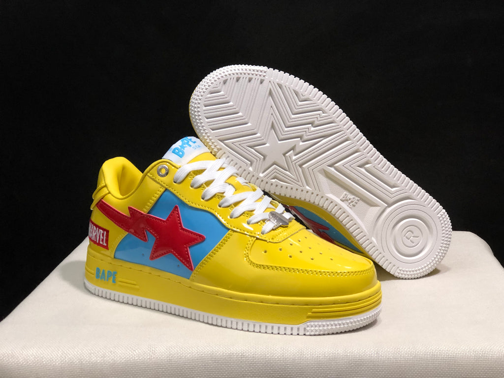 Angled view of the yellow sneakers with one shoe lifted to show the white outsole’s star and geometric tread pattern.