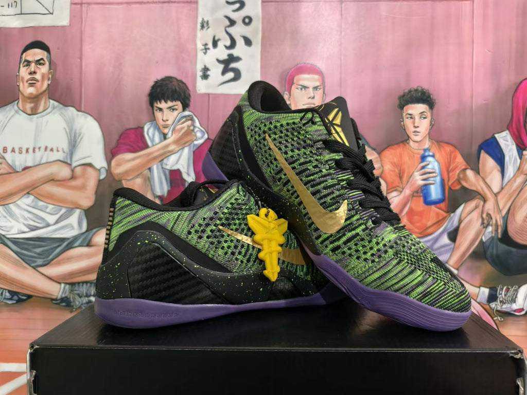 Pair of black, green, and purple basketball shoes displayed at an angle, with gold Swooshes and yellow lace charms.
