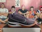 Side view of a purple Nike GT Cut 3 basketball shoe with gray Swoosh and gum-colored outsole.