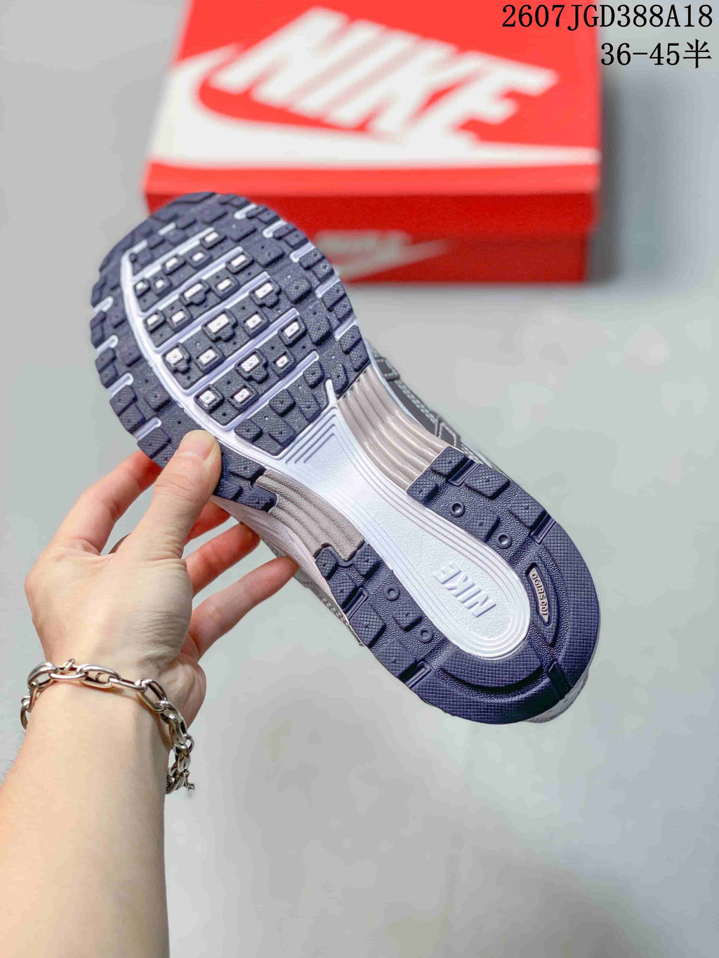 Close view of the Nike P-6000 outsole showing segmented dark tread and a light-colored midsole.