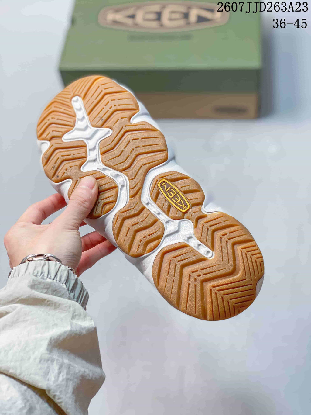 Close view of the tan-patterned segmented outsole on a KEEN sandal.