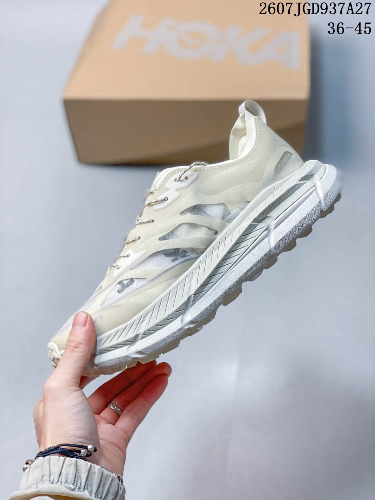 Side view highlighting the layered upper panels, translucent-looking side sections, and thick white sole.