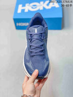 Front view of the blue lace-up running shoe with a textured upper and padded tongue.