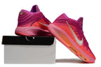 Pink and purple Nike GT Hustle 3 shoes displayed from the rear and side.