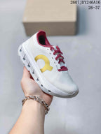 White On Cloudstratus 3 kids running shoe with a yellow side logo and burgundy lining and laces.