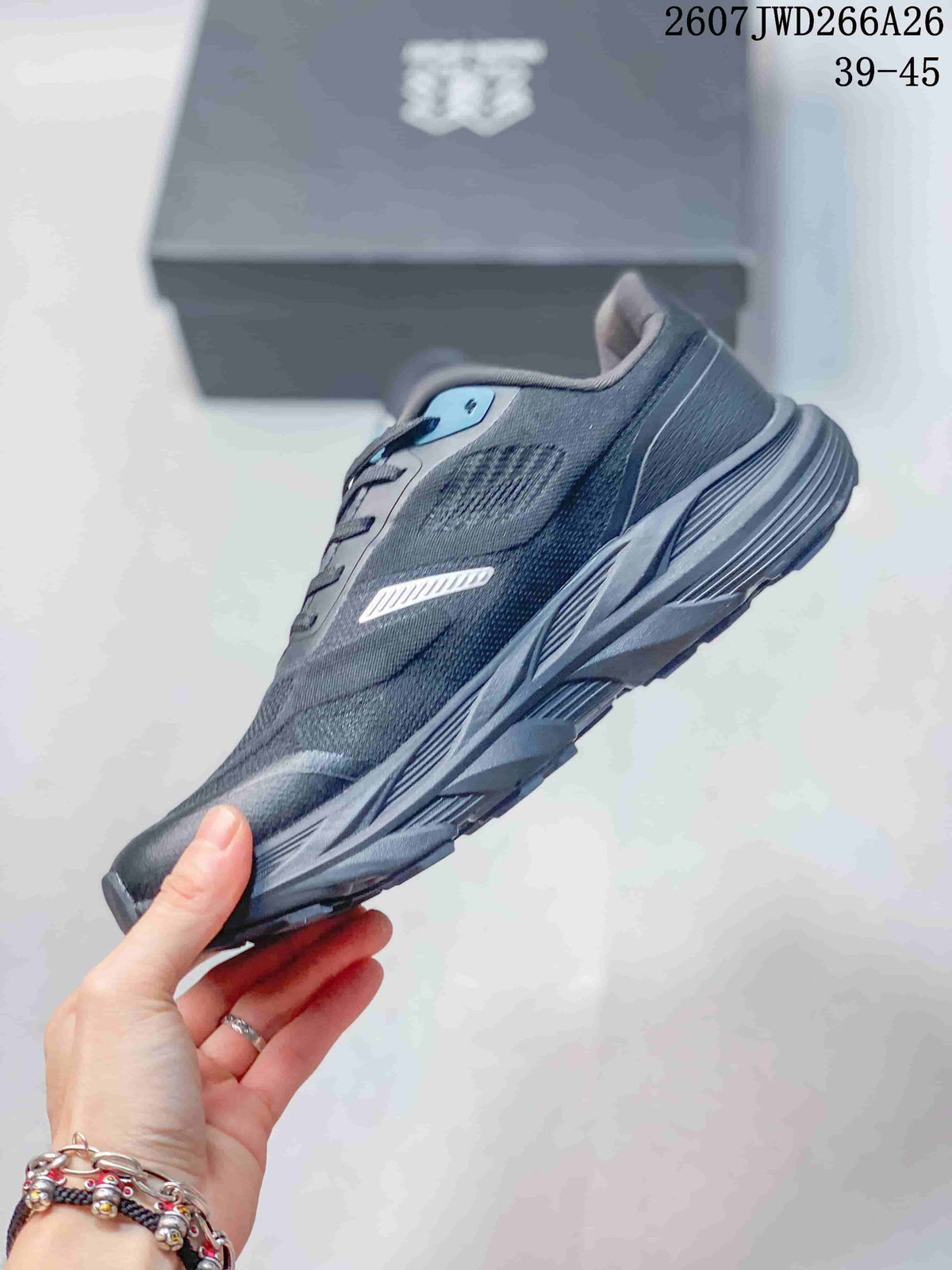Side view of the dark KRUST trail running shoe showing the woven upper, reflective side detail, layered midsole, and lugged outsole.