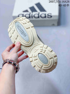 Close view of the textured outsole showing its layered circular and geometric tread pattern.