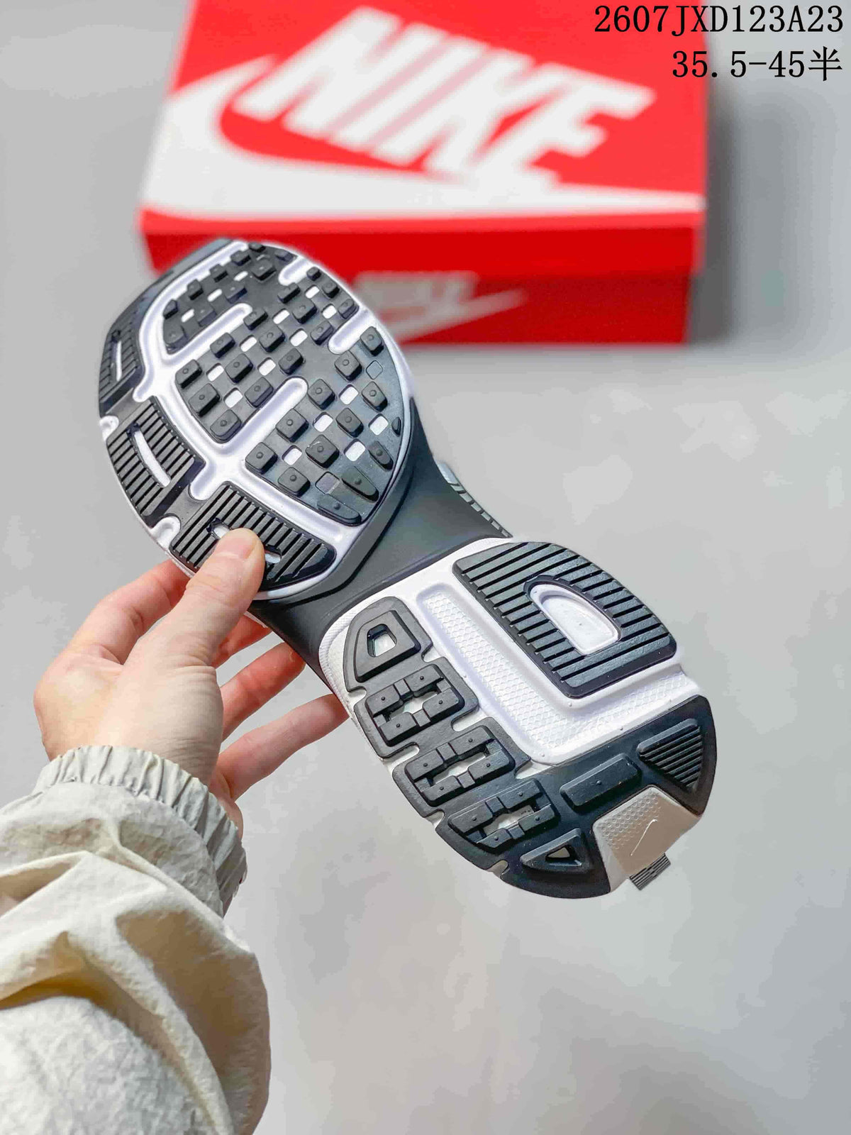 Close view of the patterned black, white, and gray rubber outsole.