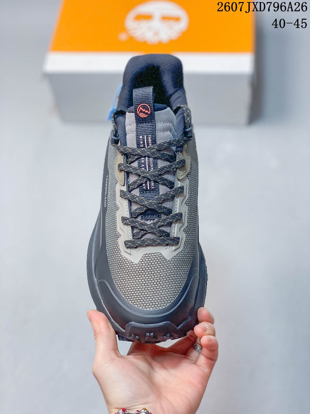 Top view showing the lace-up design, padded tongue, gray upper, and contrasting tan details.