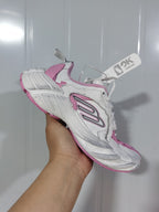 Three-quarter view of the 5191 sneaker highlighting the white upper, pink trim, grey side detailing, and pink outsole edge.