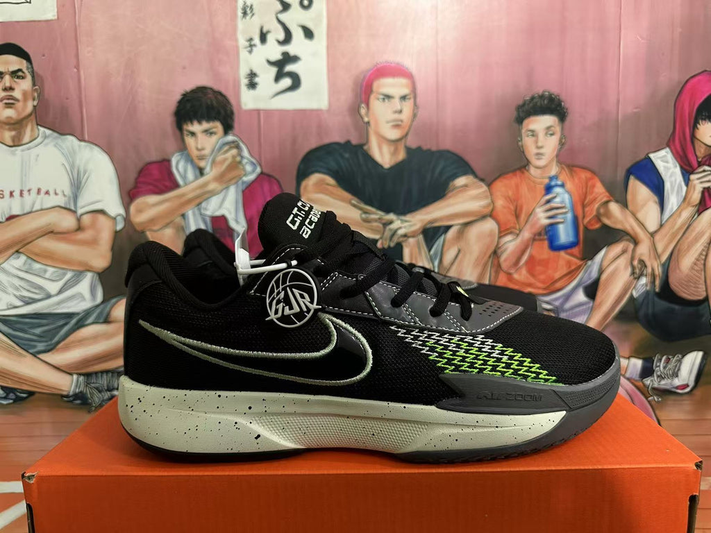 Side profile of a black Nike GT Cut 3 basketball shoe with a contrasting green Swoosh, patterned side detail and speckled midsole.