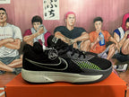 Side profile of a black Nike GT Cut 3 basketball shoe with a contrasting green Swoosh, patterned side detail and speckled midsole.