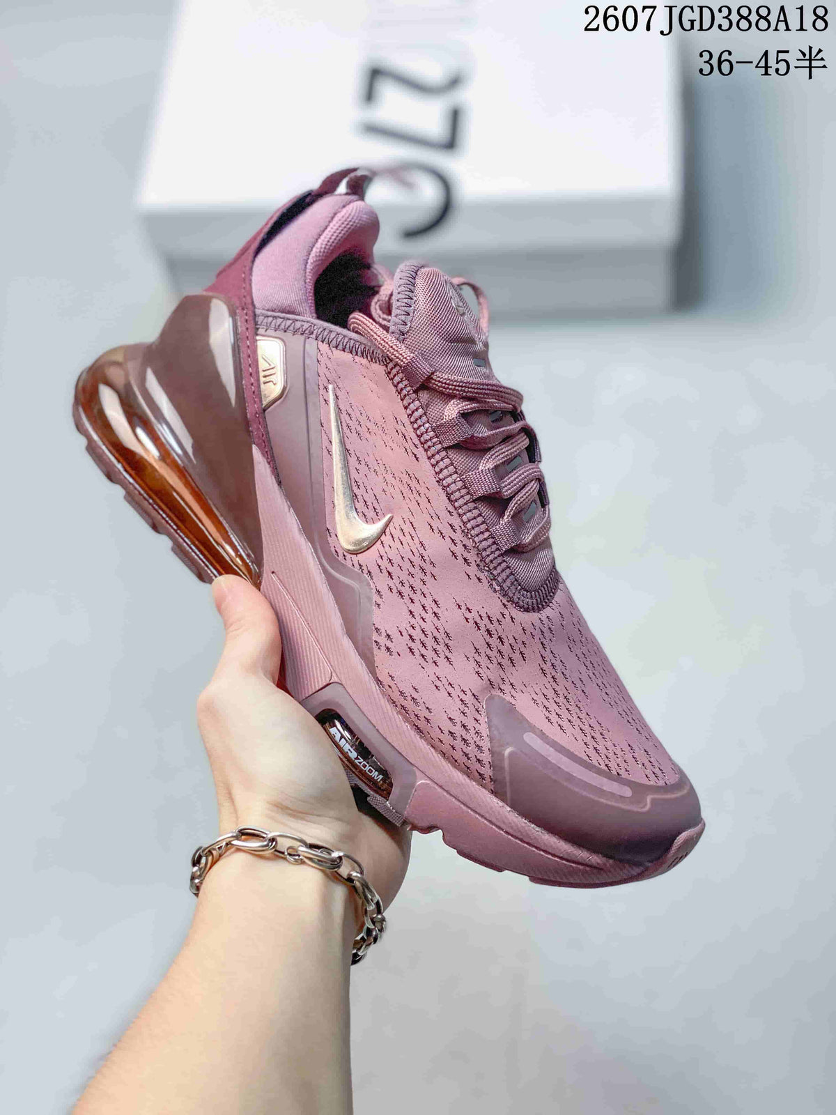 Pink Nike Air Max 270 Premium sneaker with tonal detailing and a translucent pink-brown heel air unit.