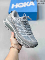 Light gray and white HOKA Mafate Speed 2 sneaker shown at an angled front view.