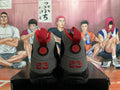Rear view of black and grey Jordan high-top sneakers with red heel details
