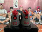 Rear view of black and grey Jordan high-top sneakers with red heel details