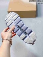 Close view of the sneaker outsole with rectangular tread sections and recessed openings.