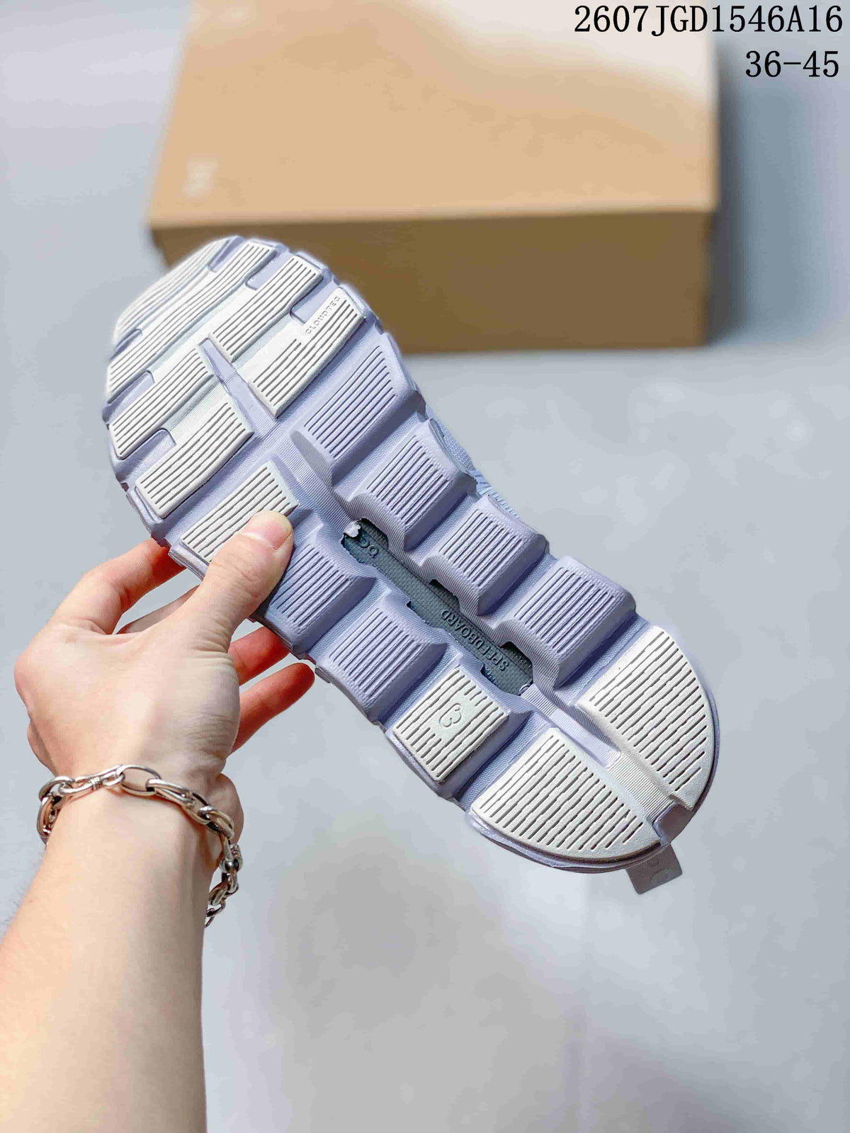 Close view of the sneaker outsole with rectangular tread sections and recessed openings.