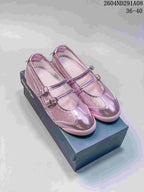 Pair of pink metallic Onitsuka Tiger Mary Jane-style sneakers displayed on a shoebox; product code 2604ND291A08 and size range 36-40 are visible.