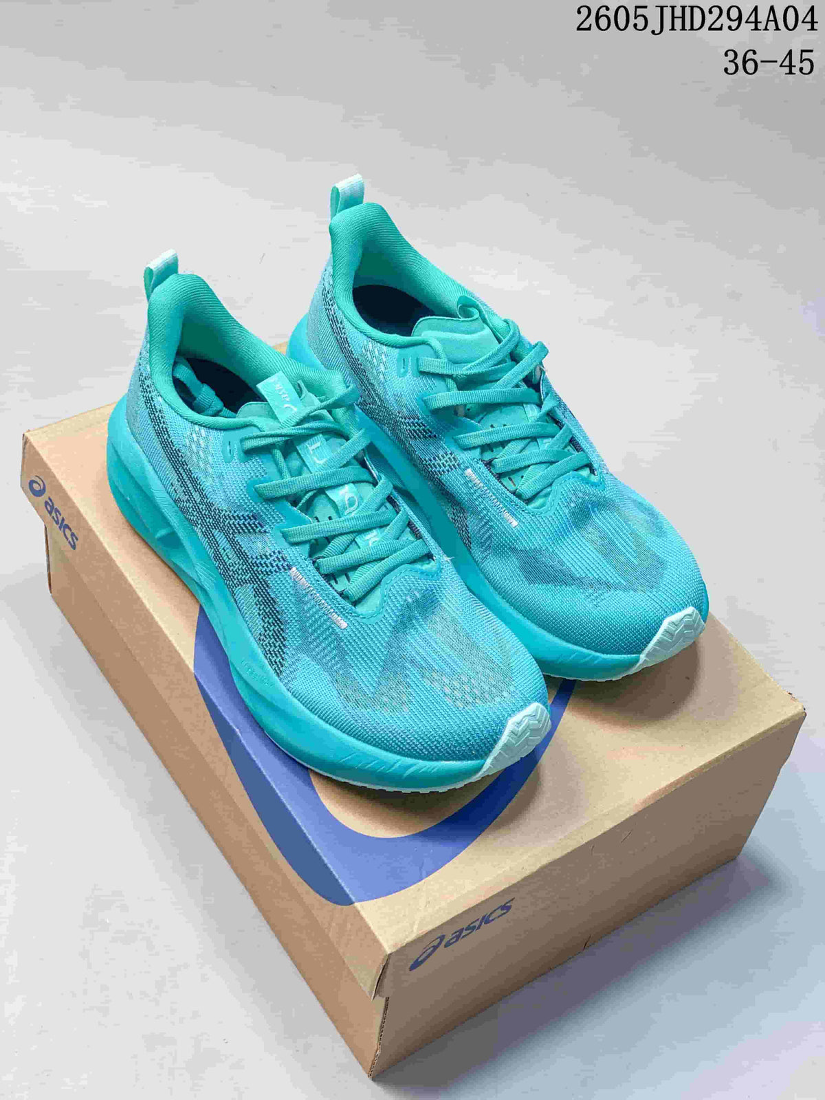 Pair of turquoise ASICS NOVABLAST 5 LE running shoes displayed on a shoe box