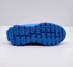 Underside view showing the blue outsole with a segmented tread pattern.