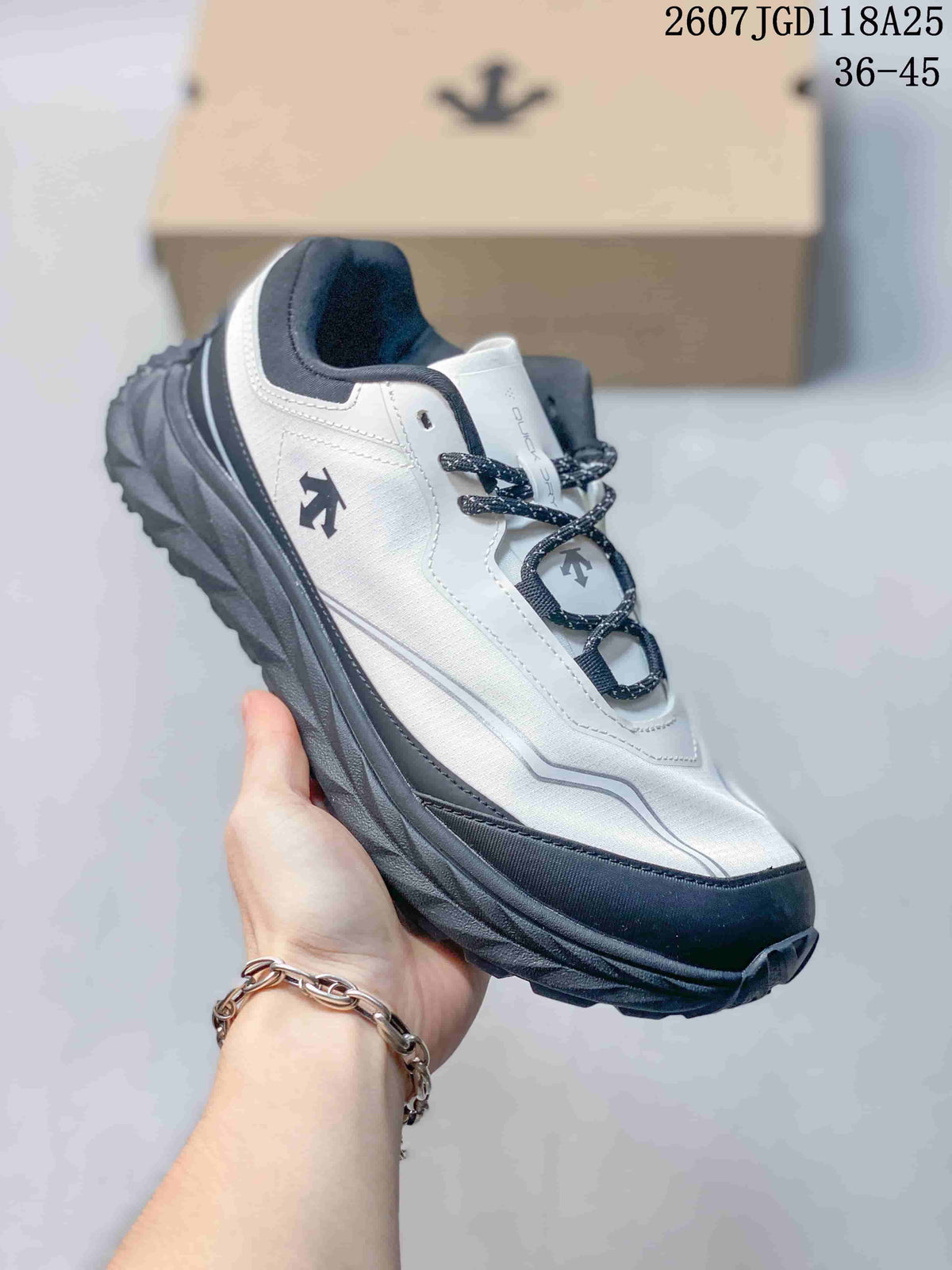 Angled side view of the white and black low-top sneaker with its rugged outsole.