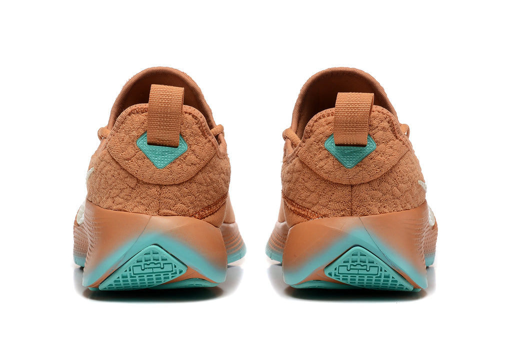 Rear view highlighting the heel pull tabs and teal outsole accents