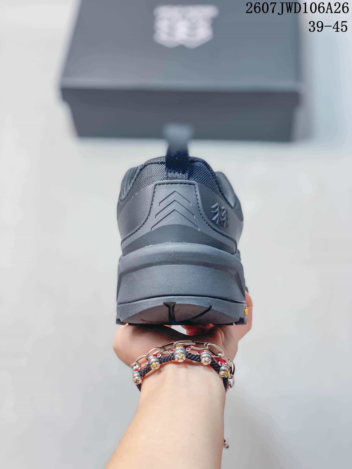 Rear view of the dark gray hiking shoe showing the heel structure, pull tab, and layered sole.