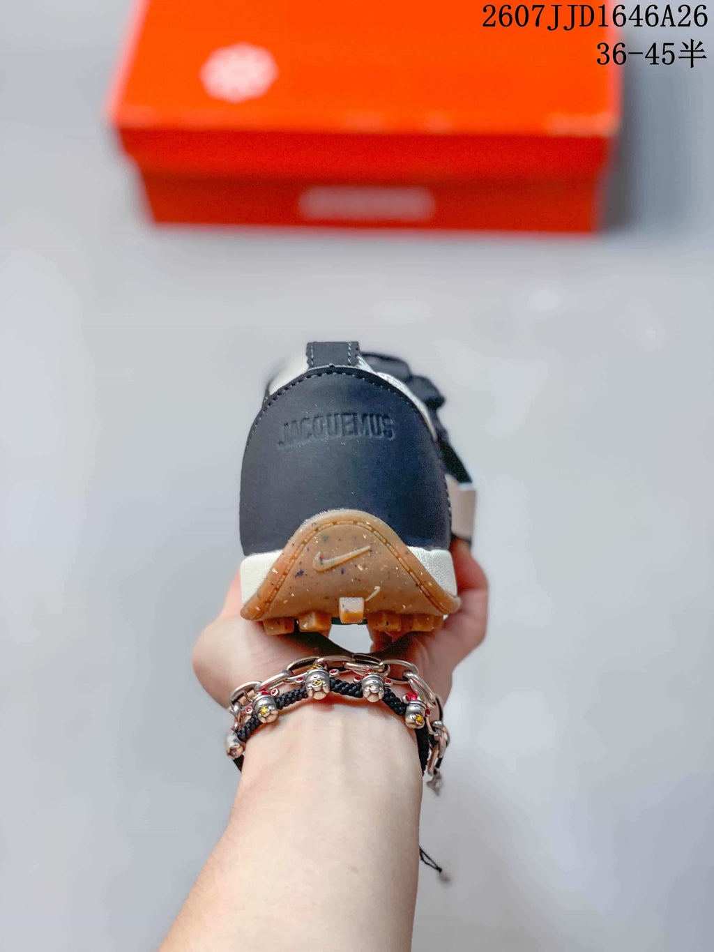 Rear view showing Jacquemus branding on the heel and the gum-colored outsole edge.