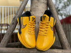 Front view showing perforated toe areas, laces, and tongue logos.