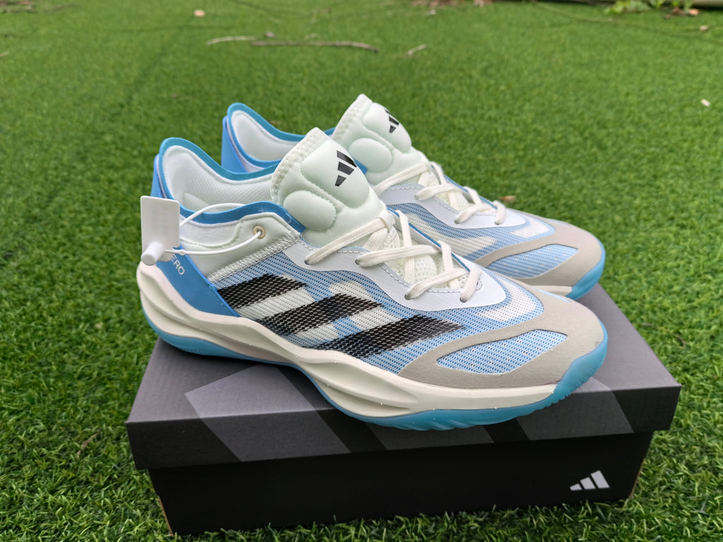 Side view of the white and blue Adidas Adizero shoes with black stripes.