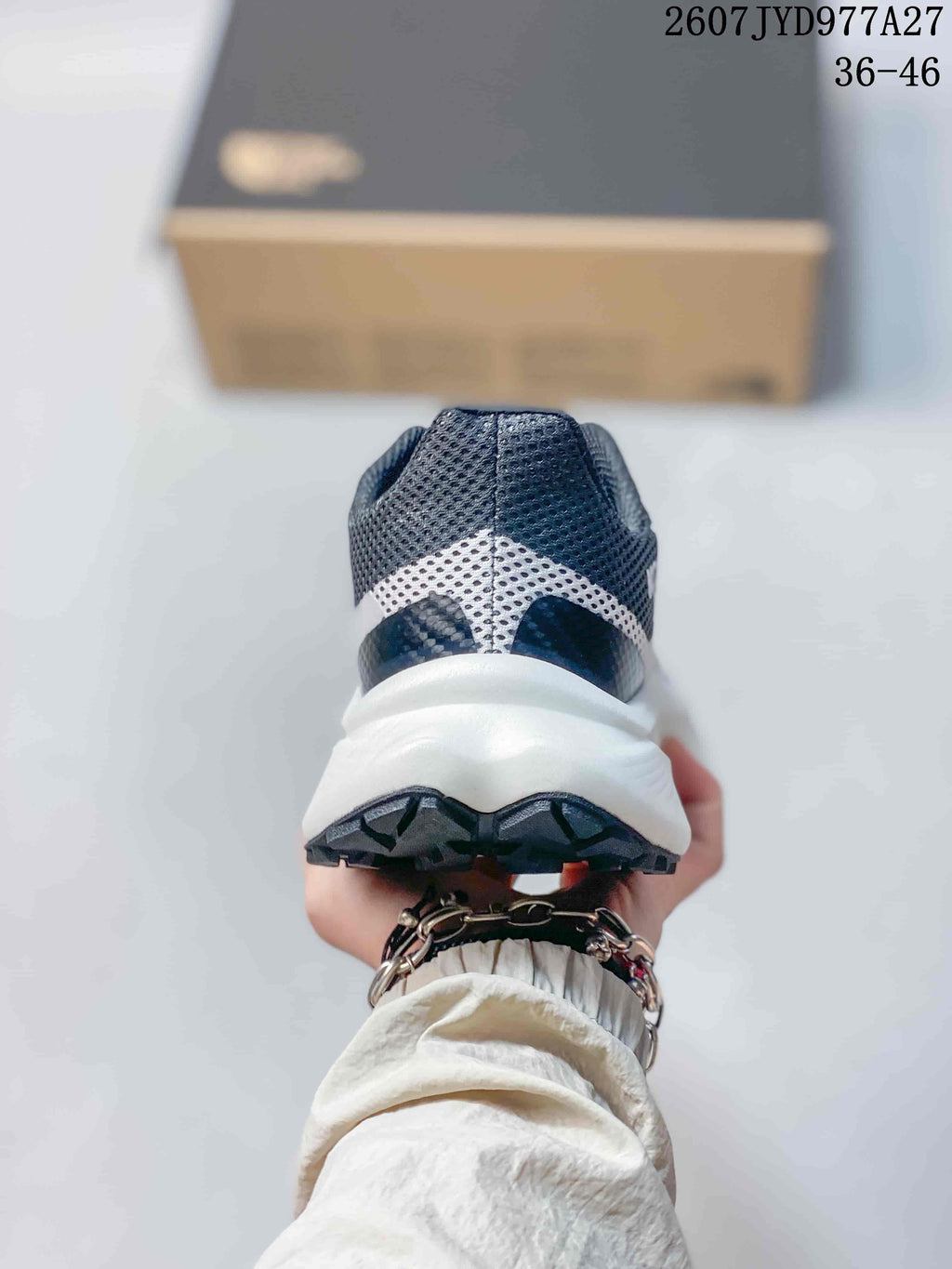 Rear view showing the mesh heel, white midsole, and dark outsole.