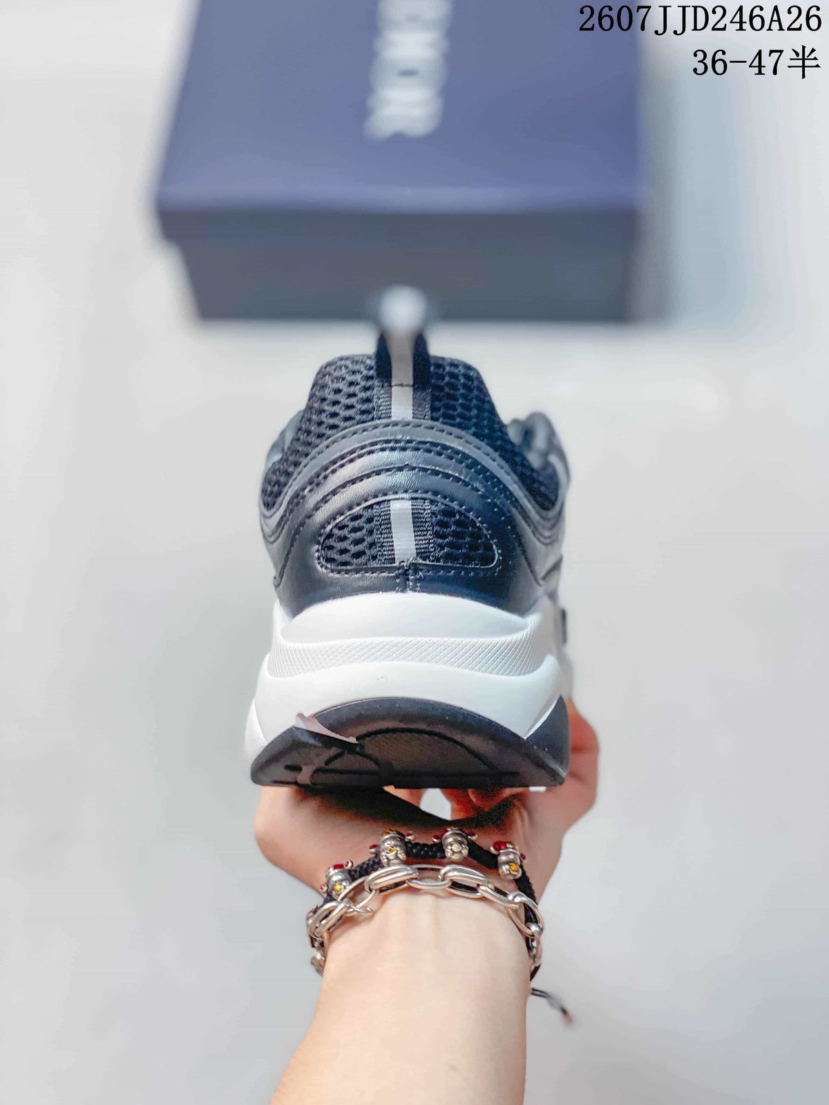 Rear view of the sneaker showing the padded heel, pull tabs, layered panels, and contrasting sole.