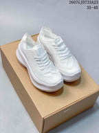 Pair of white Salomon Phantasm 2 sneakers displayed on a cardboard box, with the listed size range 35–40 visible above.