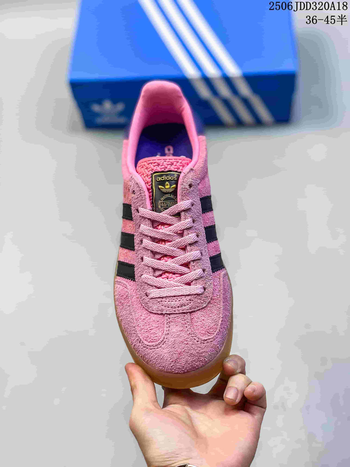 Front view showing the pink textured toe box, matching laces and branded tongue label.