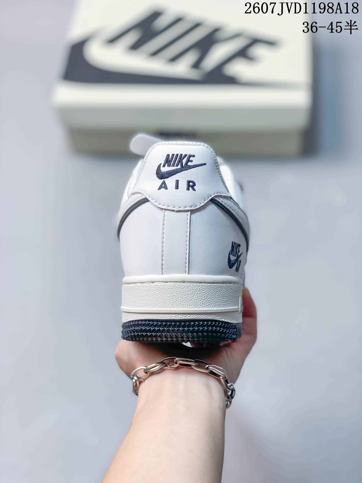 Rear view showing the padded heel, Nike Air branding and dark outsole edge.