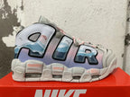 Side view showing oversized AIR lettering, blue graphic panels, and lavender and pink accents