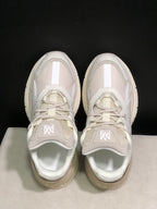 Top-down view showing the mesh tongues, tonal laces, layered toe panels and padded collars.